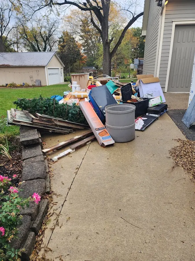 Dumpster being loaded with debris for 30 Yard Dumpster Rental in Hanover